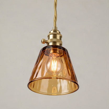 Angled view showing the open lower rim of the amber shade and the bulb inside