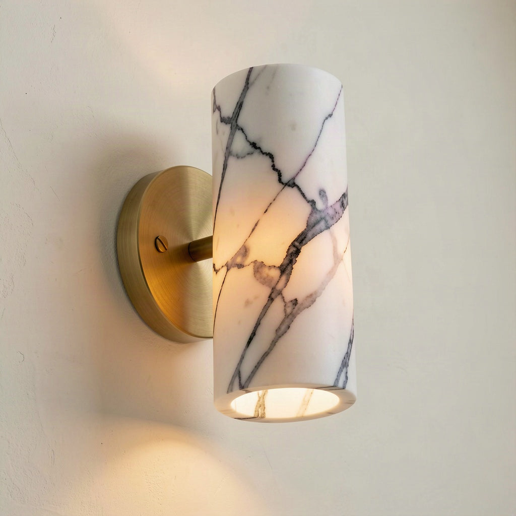 Angled view showing the open top and bottom of the marble cylinder and the brass stem