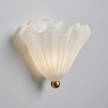Angled view showing the scalloped rim and 13cm projection of the shell wall light