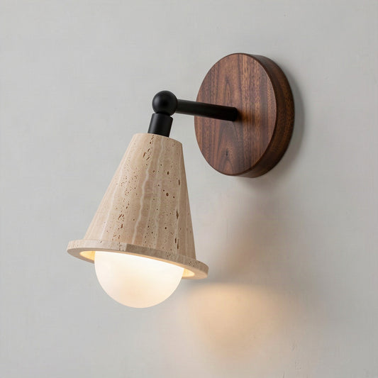 Travertine cone wall light with an opal glass globe and round walnut backplate, lit against a plain wall