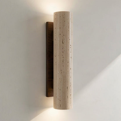 Angled view showing the travertine column standing clear of its wood backplate