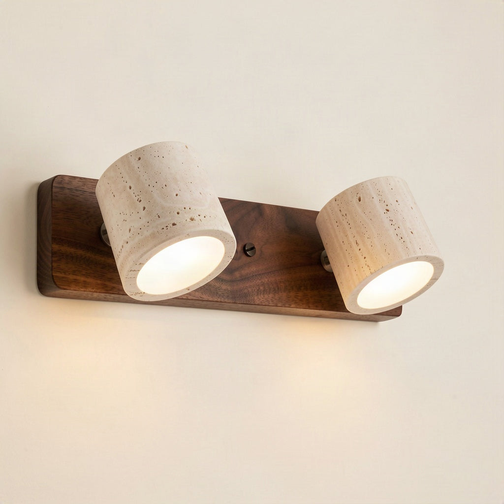 Two-head travertine wall light with rotatable shades on a dark walnut bar