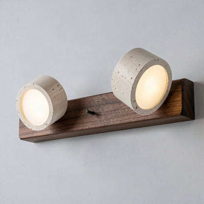 Angled view showing both travertine heads turned in different directions on the wooden bar