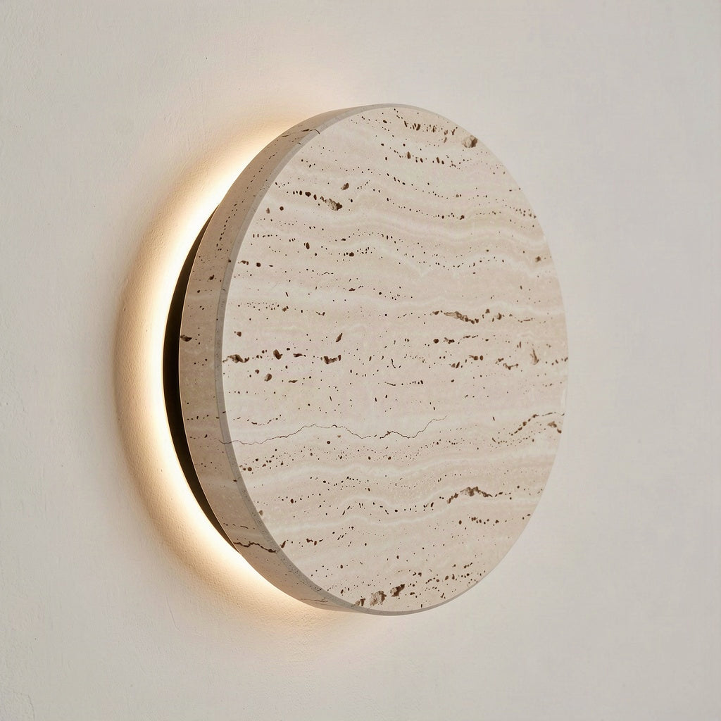 Angled view showing the thickness of the travertine disc and the light escaping behind it