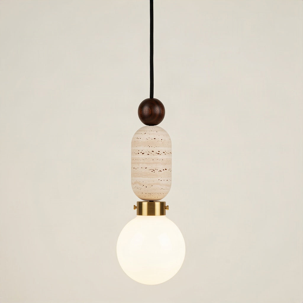 Travertine pendant light with a walnut bead above the stone body and an opal glass globe below