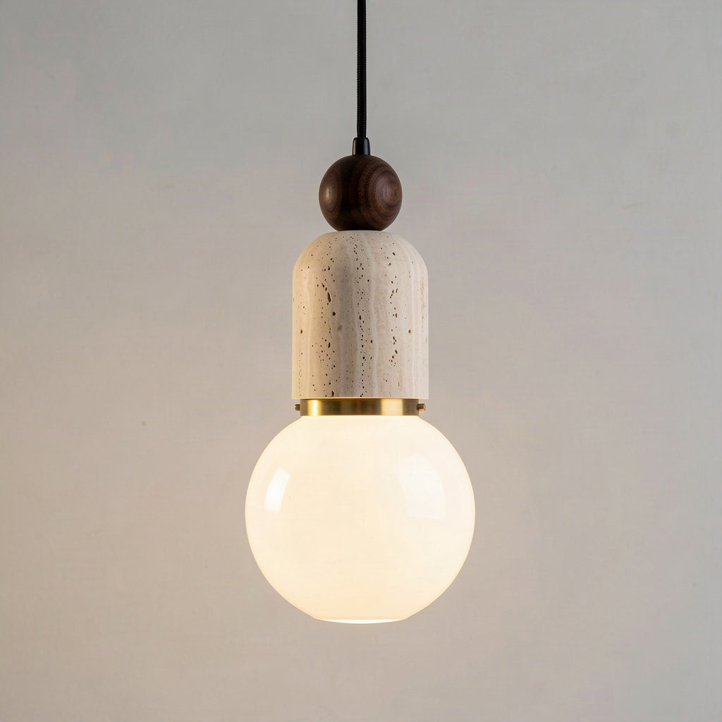 Angled view of the pendant showing the stacked walnut bead, travertine body and opal globe