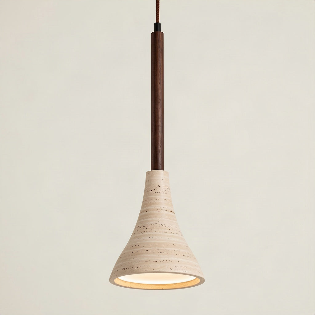 Travertine trumpet pendant light with a flared stone shade on a walnut wood stem, lit against a plain wall