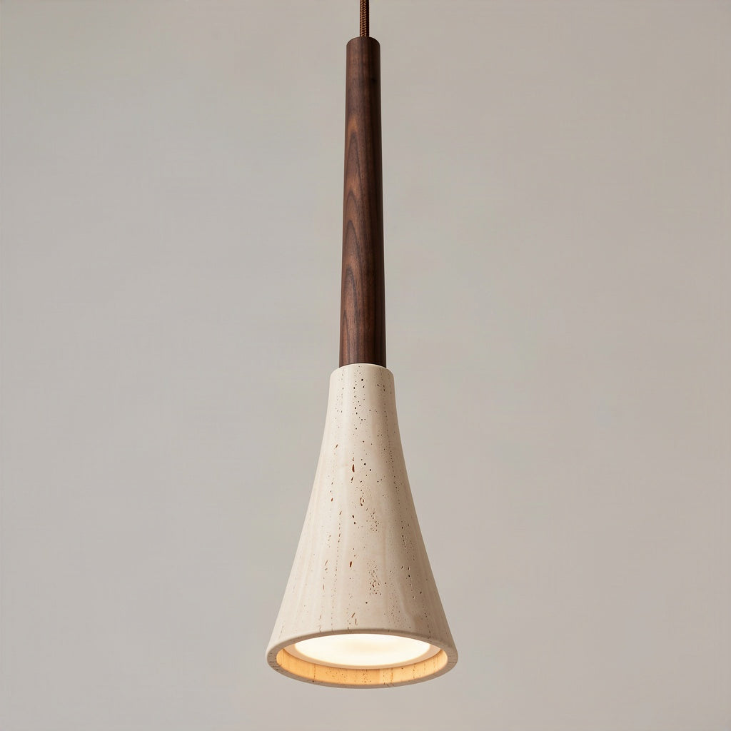 Angled view of the flared travertine shade and the turned walnut stem above it